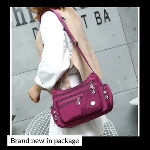 Multiple compartment waterproof purple purse tote travel bag brand new